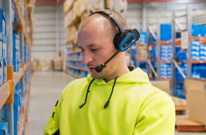 Man wearing Honeywell Vocollect Voicelink technology