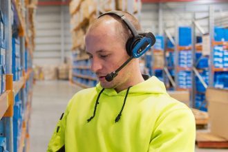 Man wearing Honeywell Vocollect Voicelink technology